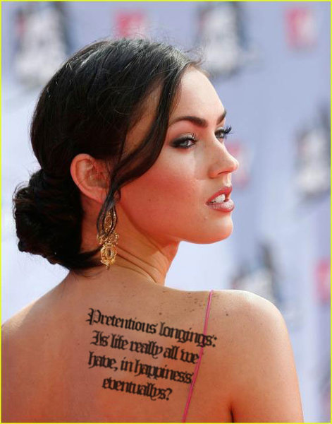 Megan Fox tattoo Its from like the large Old English text on her left rib